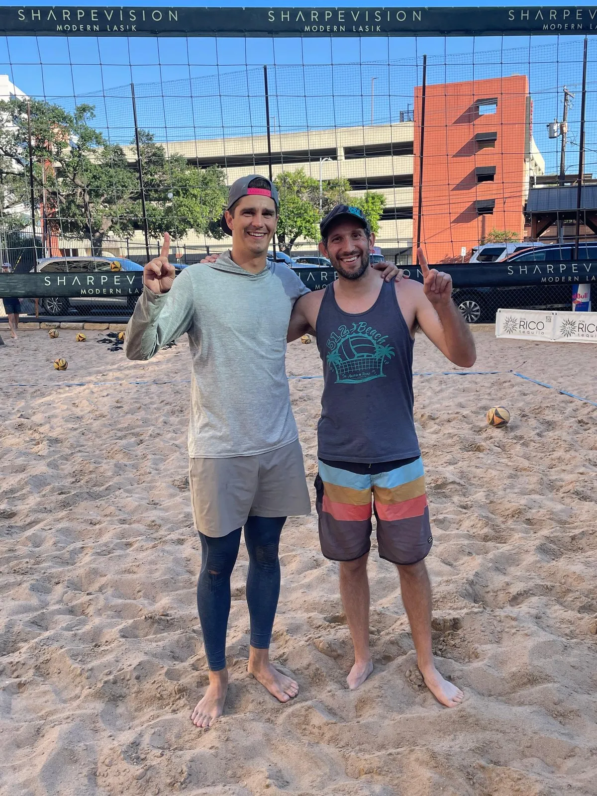 Hagen and Ben flashing number one in front of the net after winning