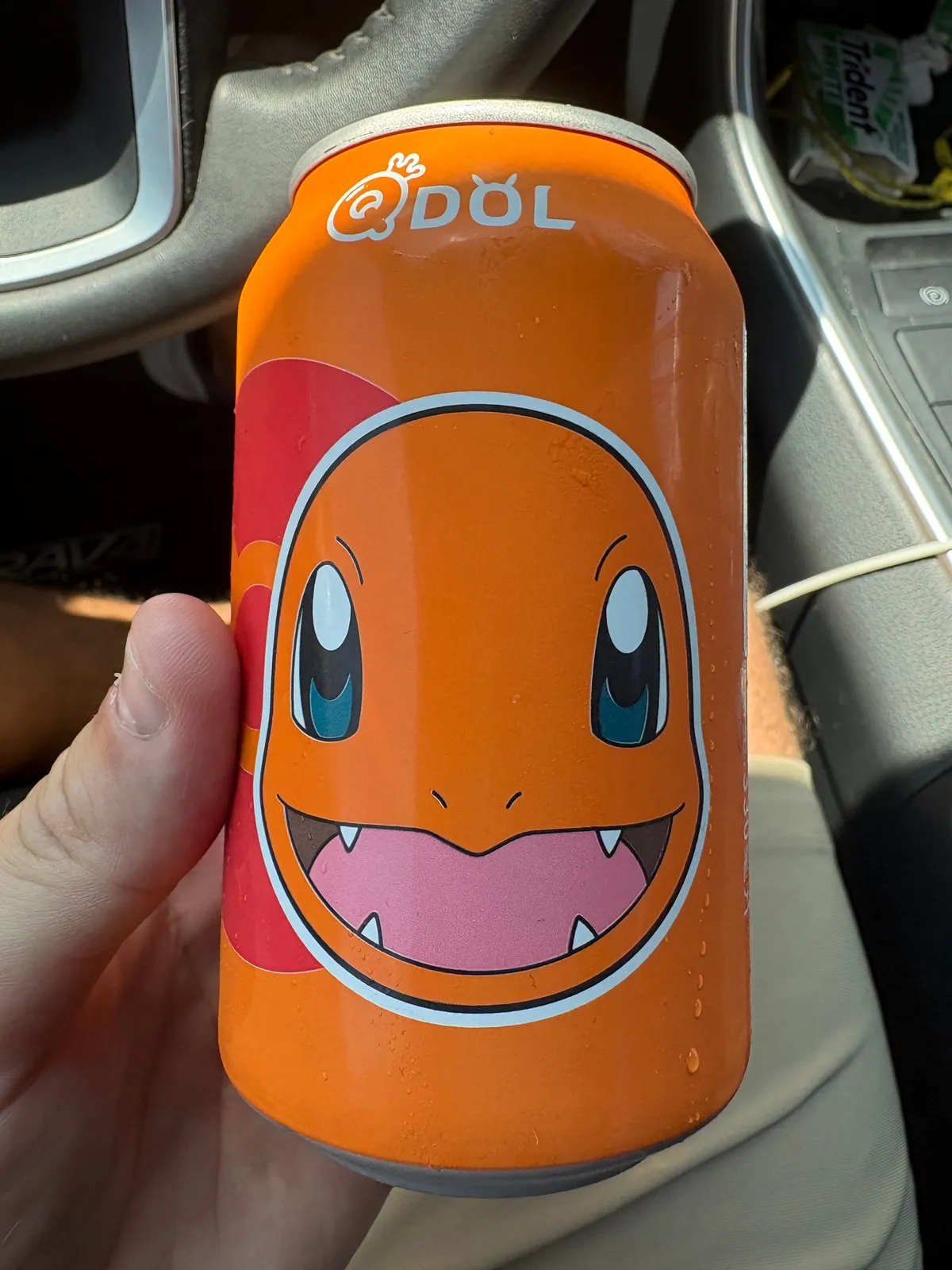 Orange QDOL Charmander sparkling water can, lychee flavor