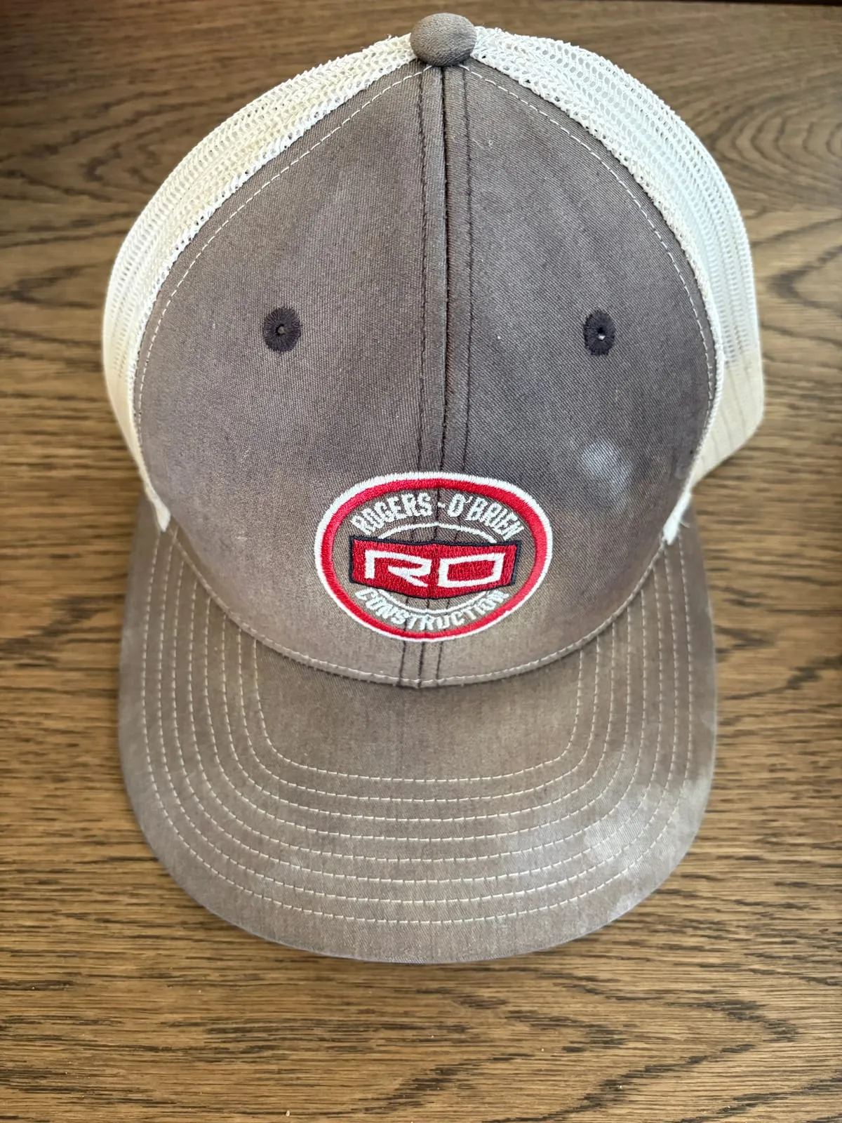 Retired black Rogers-O'Brien Construction trucker hat
