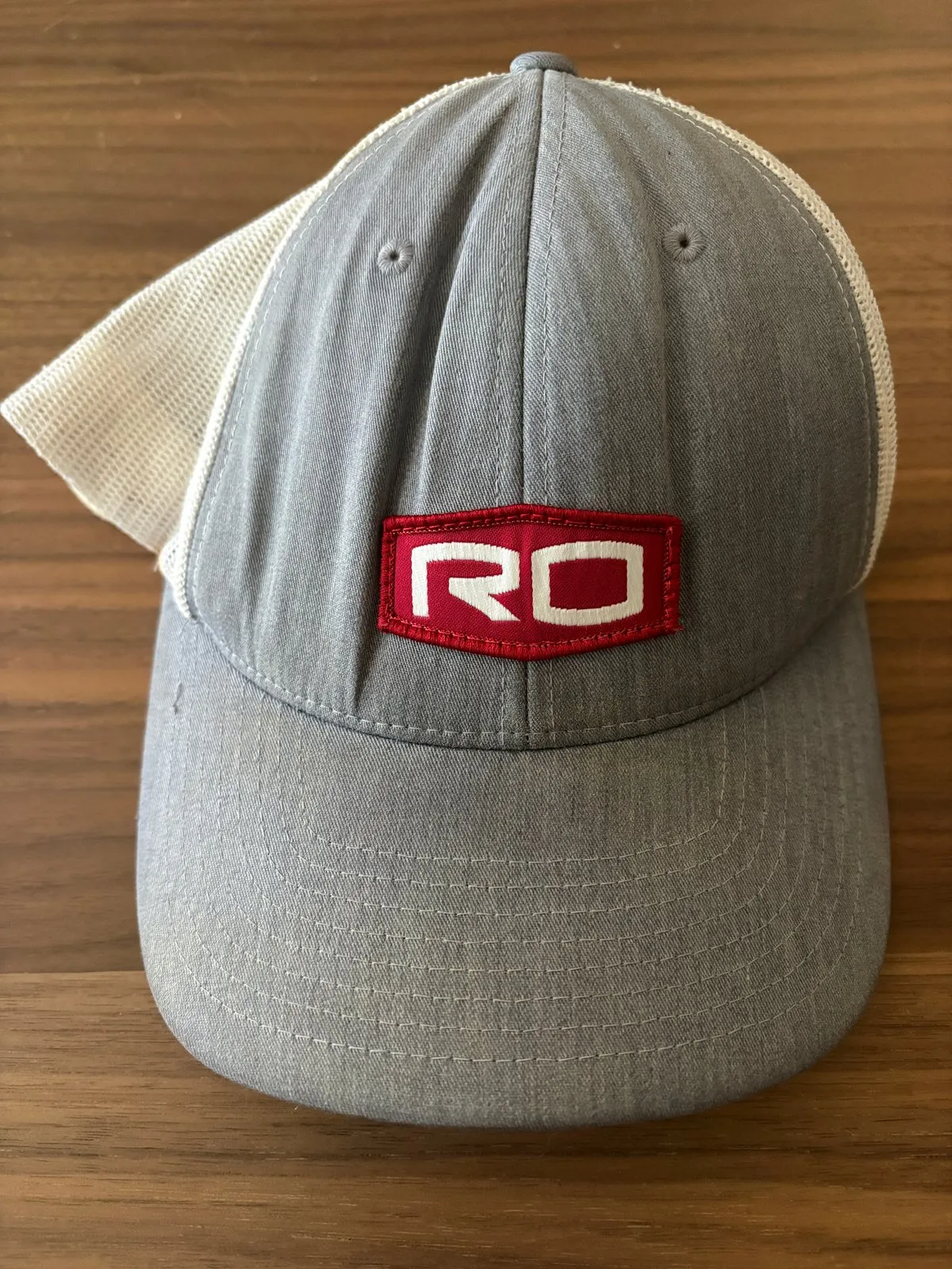Retired gray Rogers-O'Brien trucker hat with red RO patch